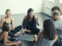 group of people sitting in a circle